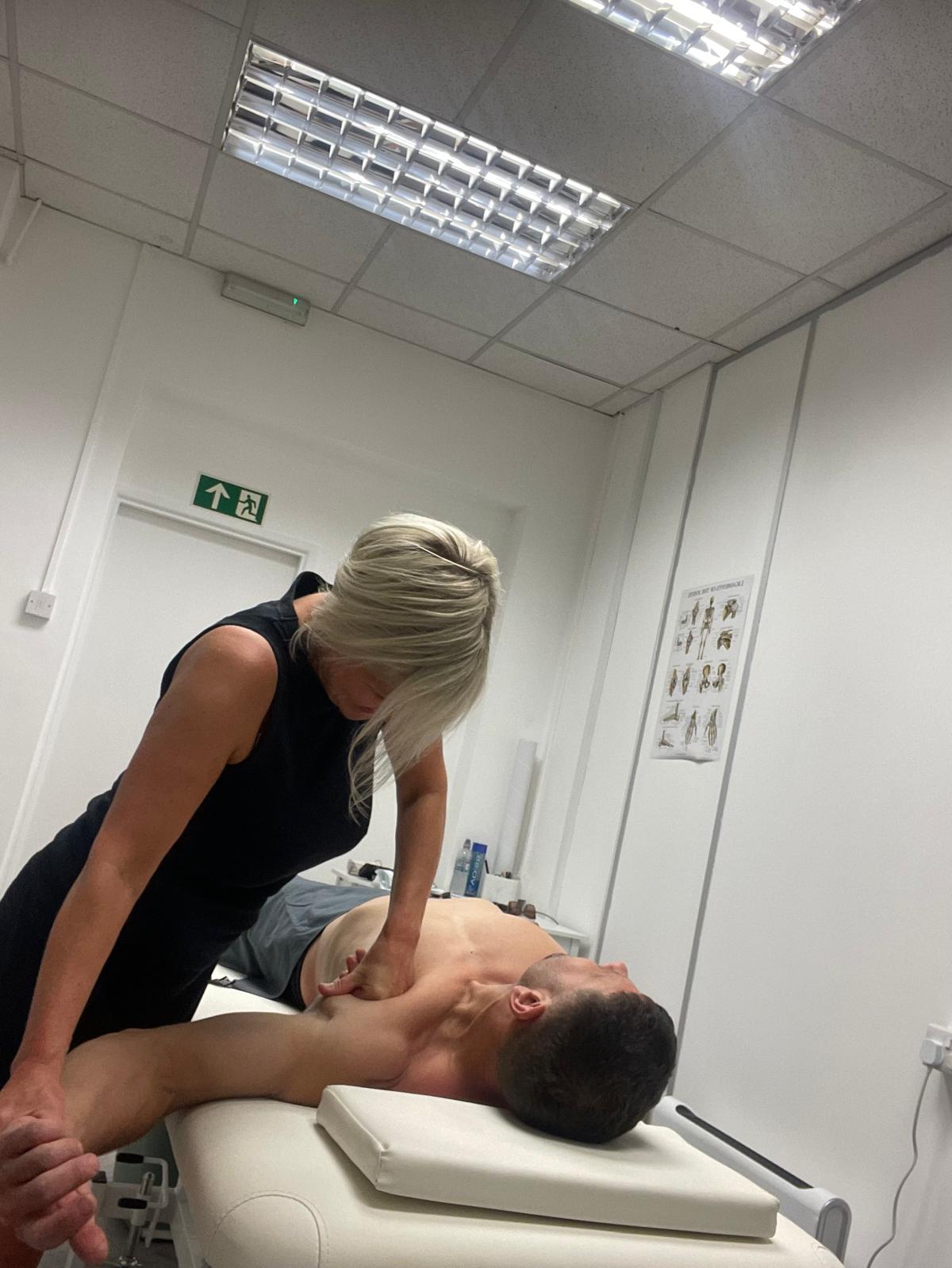 Lisa providing hands-on sports massage treatment